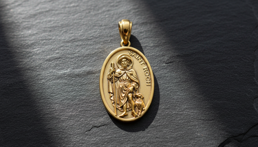 Close-up detail of Saint Roch Medal Pendant gold-tone sterling silver pendant highlighting intricate pilgrim staff and dog sculpture