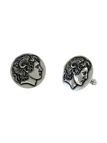 Close-up detail of a single Alexander the Great sterling silver cufflink, focusing on the divine ram's horn and the coin-like finish.