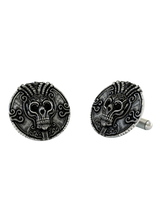 Close-up detail of a single Aztec Warrior sterling silver cufflink, focusing on the ornate skull, intricate headdress, and surrounding patterns.