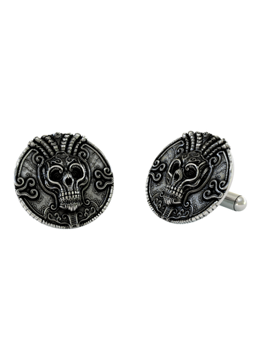 Close-up detail of a single Aztec Warrior sterling silver cufflink, focusing on the ornate skull, intricate headdress, and surrounding patterns.