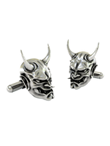 Close-up detail of a single Japanese Oni demon sterling silver cufflink, focusing on the sharp horns and expressive facial details.