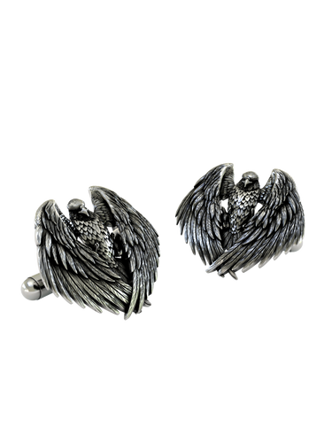 Close-up detail of a single Majestic Eagle sterling silver cufflink, focusing on the sharp gaze and the texture of the individual feathers.