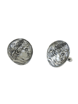 Close-up detail of a single Roman coin sterling silver cufflink, focusing on the intricate laurel wreath and the classical profile.