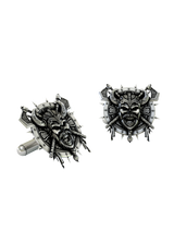 Close-up detail of a single Viking Berserker sterling silver cufflink, focusing on the menacing skull face, horned helmet, and braided beard.