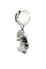 Close-up detail of the Abstract Face Earring, emphasizing the fine sculptural details of the eyes, nose, and goatee.