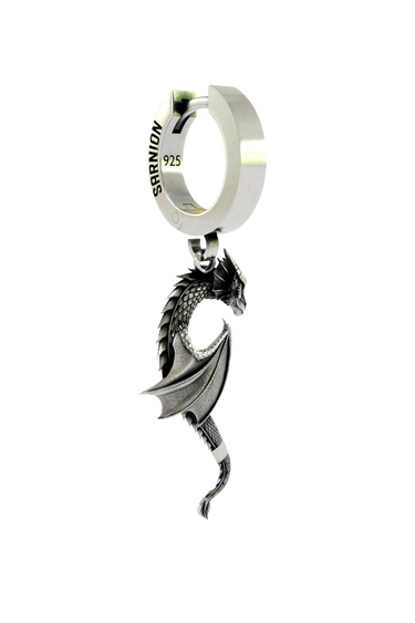 Close-up detail of the Dragon Wing Earring, emphasizing the intricate sculptural work on the dragon's head and wing.
