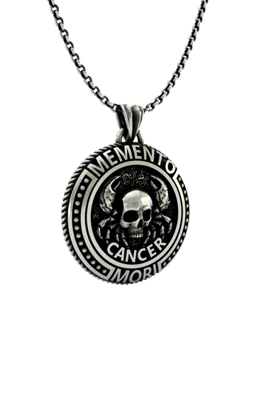 Close-up detail of the "Memento Mori" Latin inscription and the intricate skull on the Cancer Zodiac Pendant.
