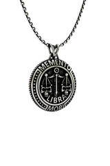 Close-up detail of the "Memento Mori" Latin inscription and the intricate skull on the Libra Zodiac Pendant.