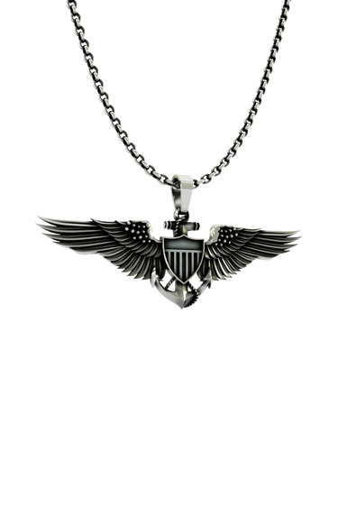 Close-up detail of the U.S. shield and fouled anchor on the Aviator Wings Pendant, showing the fine details
