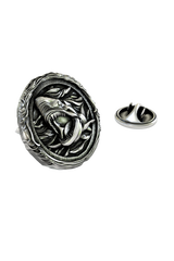 Close-up detail of the ferocious expression and wave-like border on the Silver Shark Lapel Pin.