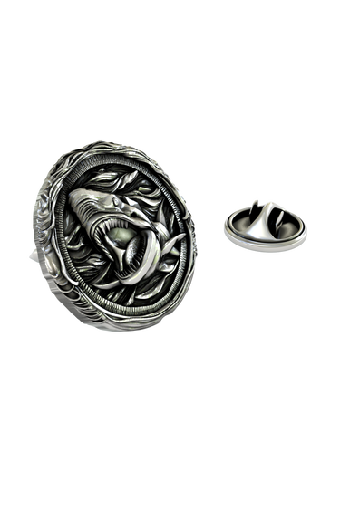 Close-up detail of the ferocious expression and wave-like border on the Silver Shark Lapel Pin.