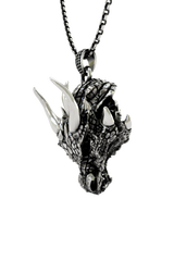 Close-up detail of the fierce expression and polished horns on the Sarnion Head Pendant, the brand's iconic mascot.