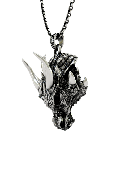 Close-up detail of the fierce expression and polished horns on the Sarnion Head Pendant, the brand's iconic mascot.