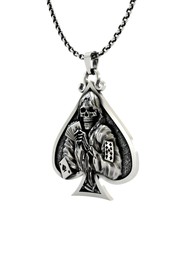 Close-up detail of the grimacing skull and playing cards on the Death Gambler Pendant.