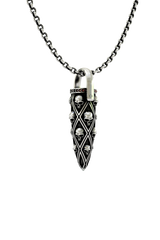 Close-up detail of the individual carved skulls and the row of red gems on the Skull Bullet Pendant.