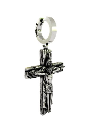 Close-up detail of the intricate engraving on the Jesus Cross Earring, highlighting the sterling silver artistry