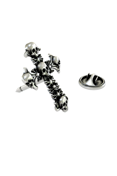 Close-up detail of the intricate, individual skulls that form the Gothic Skull Cross Pin.