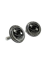 Close-up detail of the intricate skeletal structure and "Pisces" engraving on the sterling silver cufflinks.