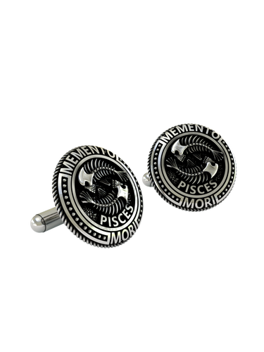 Close-up detail of the intricate skeletal structure and "Pisces" engraving on the sterling silver cufflinks.