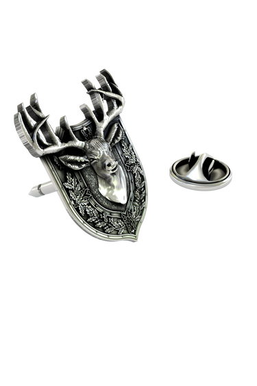 Close-up detail of the noble stag's face and the intricate oak leaves on the Stag Lapel Pin.

