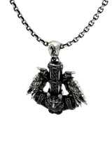 Close-up detail of the raven, wolf, and knotwork on the Huginn and Muninn Mjolnir Pendant, showing the fine craftsmanship.