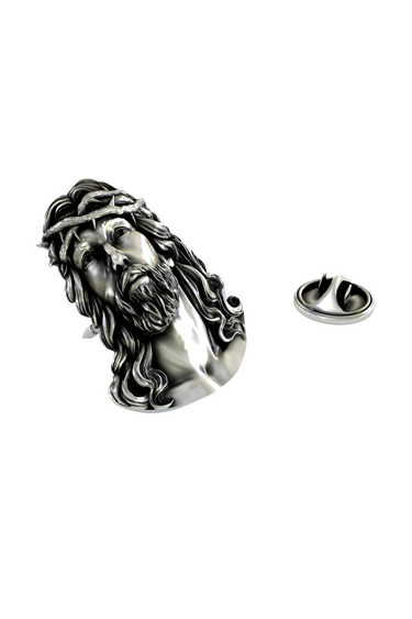Close-up detail of the reverent expression and craftsmanship on the Silver Jesus Head Pin.