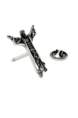 Close-up detail of the sculpted scenes and the face of Christ on the Silver Christ the Redeemer Pin.
