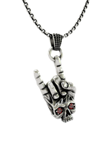 Close-up detail of the skull face and fiery red stone eyes on the Rock Skull Pendant, emphasizing the craftsmanship.