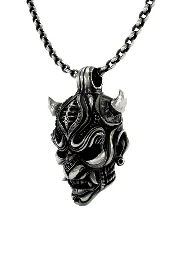 Close-up detail of the snarling fangs and intricate forehead design on the Oni Mask Pendant.