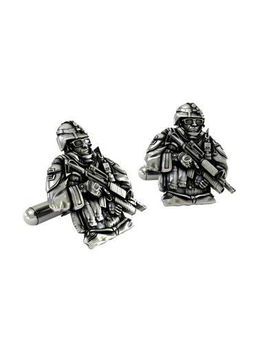 Close-up detail of the sterling silver Soldier Cufflinks, emphasizing the fine features of the helmet, glasses, and weapon.