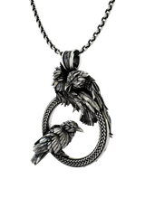 Close-up detail of the watchful ravens and the braided knotwork on the Odin Ravens Pendant.
