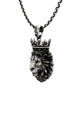 Crowned King Pendant shown on a model to demonstrate its size and regal presence as a necklace.