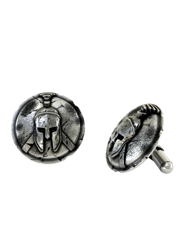 Dynamic shot of the Cracked Shield Spartan 925 silver cufflinks pair, emphasizing the heavy oxidation and historical artifact finish.