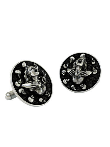 Dynamic shot of the Death's Embrace 925 silver cufflinks pair, emphasizing the dramatic expression and polished skull details.