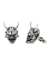 Dynamic shot of the Japanese Oni mask 925 silver cufflinks pair, emphasizing the deep shadows in the eyes and mouth for a dramatic effect.