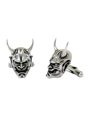 Dynamic shot of the Japanese Oni mask 925 silver cufflinks pair, emphasizing the deep shadows in the eyes and mouth for a dramatic effect.