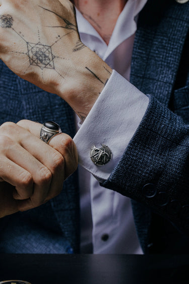 Dynamic shot of the Spartan shield 925 silver cufflinks pair, emphasizing the contrast between the polished crest and the rugged shield.