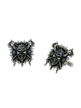 Dynamic shot of the Viking Skull 925 silver cufflinks pair, emphasizing the aggressive design and intricate Celtic knotwork on the axes.