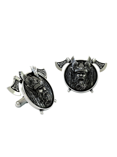 Dynamic shot of the Viking Warrior 925 silver cufflinks pair, emphasizing the textured wood-grain shield and Celtic knotwork on the axes.