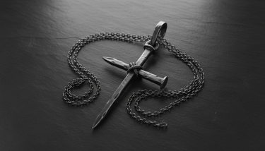 Front view of Nail Cross Pendant 925 silver pendant showcasing oxidized finish and crossed nail design