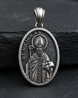 Front view of Saint Nicholas Medal Pendant sterling silver pendant displaying bishop in ornate vestments holding Gospel book