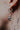 Hanging Bat Earring in 925 sterling silver - front view showcasing the detailed face and polished, wrapped wings