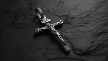 INRI Crucifix Pendant sterling silver cross shown with chain on white background demonstrating wearable size