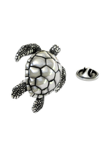 Macro shot of the Silver Sea Turtle Lapel Pin, focusing on the contrast between the smooth shell and textured skin