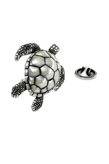 Macro shot of the Silver Sea Turtle Lapel Pin, focusing on the contrast between the smooth shell and textured skin