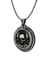 Memento Mori Cancer Pendant shown on a model to demonstrate its size and wearability as a statement necklace.