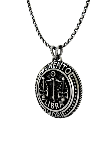 Memento Mori Libra Pendant shown on a model to demonstrate its size and wearability as a statement necklace.