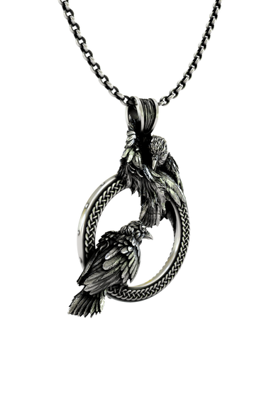Odin Ravens Pendant shown on a model to demonstrate its size and wearability as a powerful Norse amulet.