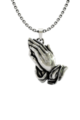 Oni Mask Pendant shown on a model to demonstrate its size and powerful presence as a statement necklace.