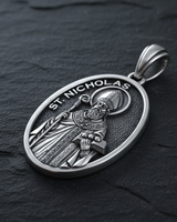 Saint Nicholas Medal Pendant sterling silver pendant on textured stone background showing dimensional depth and craftsmanship